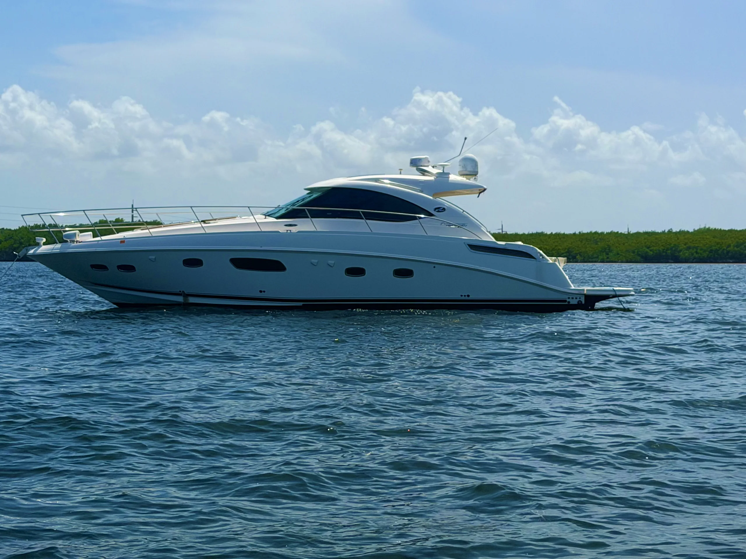 Sea Ray 470 Sundancer cruising the calm waters of Biscayne Bay