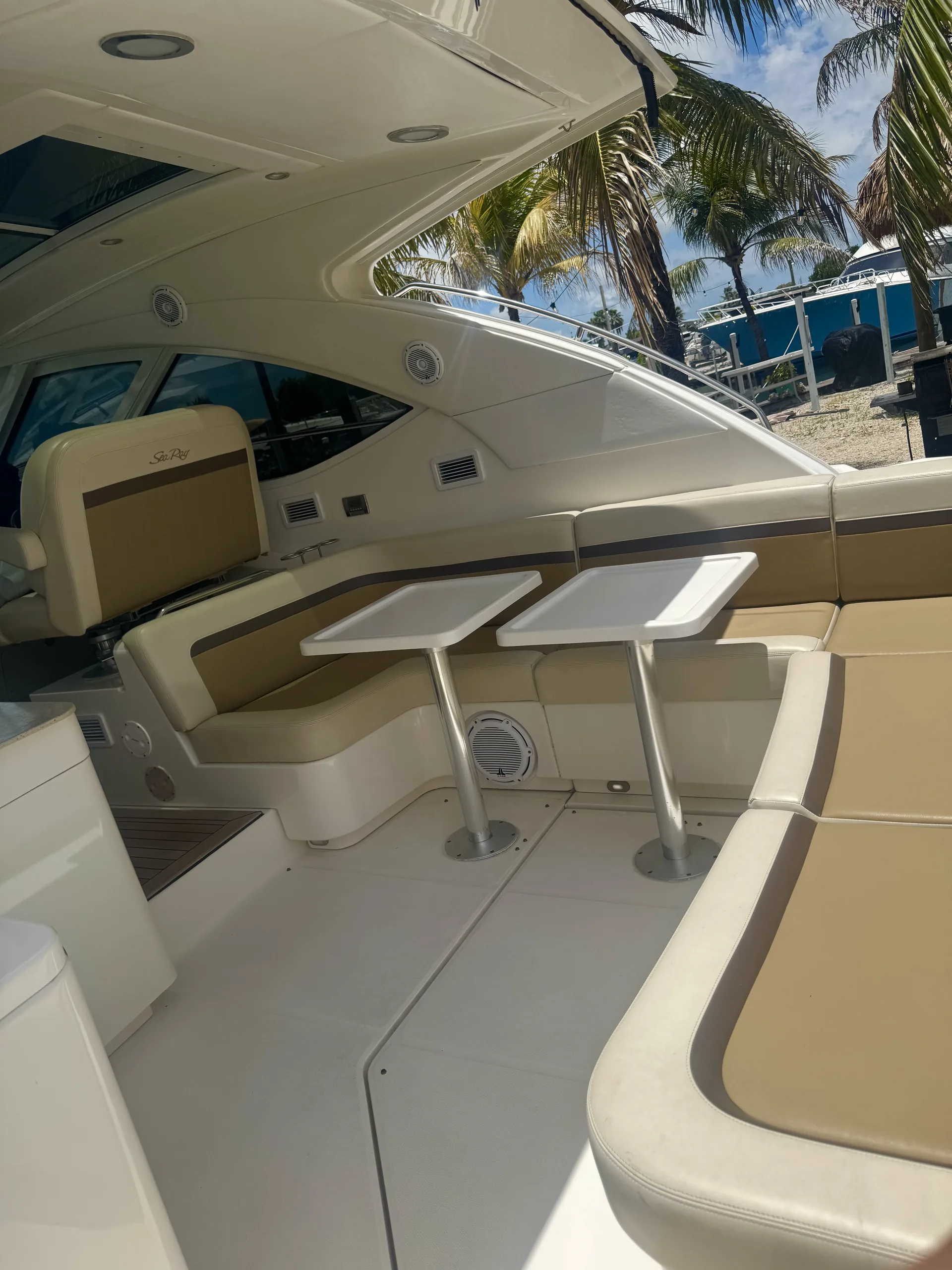 Cockpit lounge with cream seating beneath the shaded hardtop