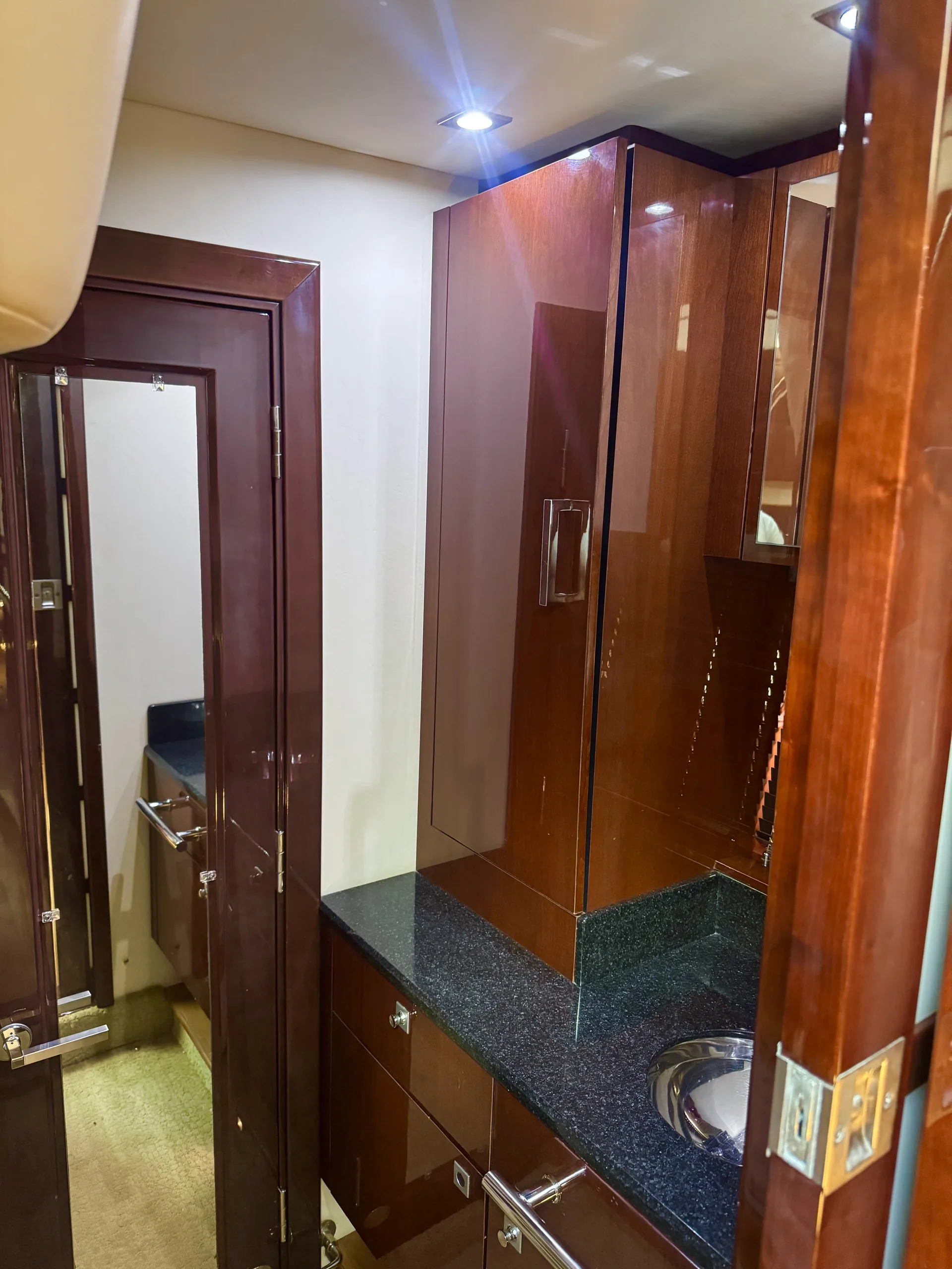 The head with vanity, sink and full-length mirror