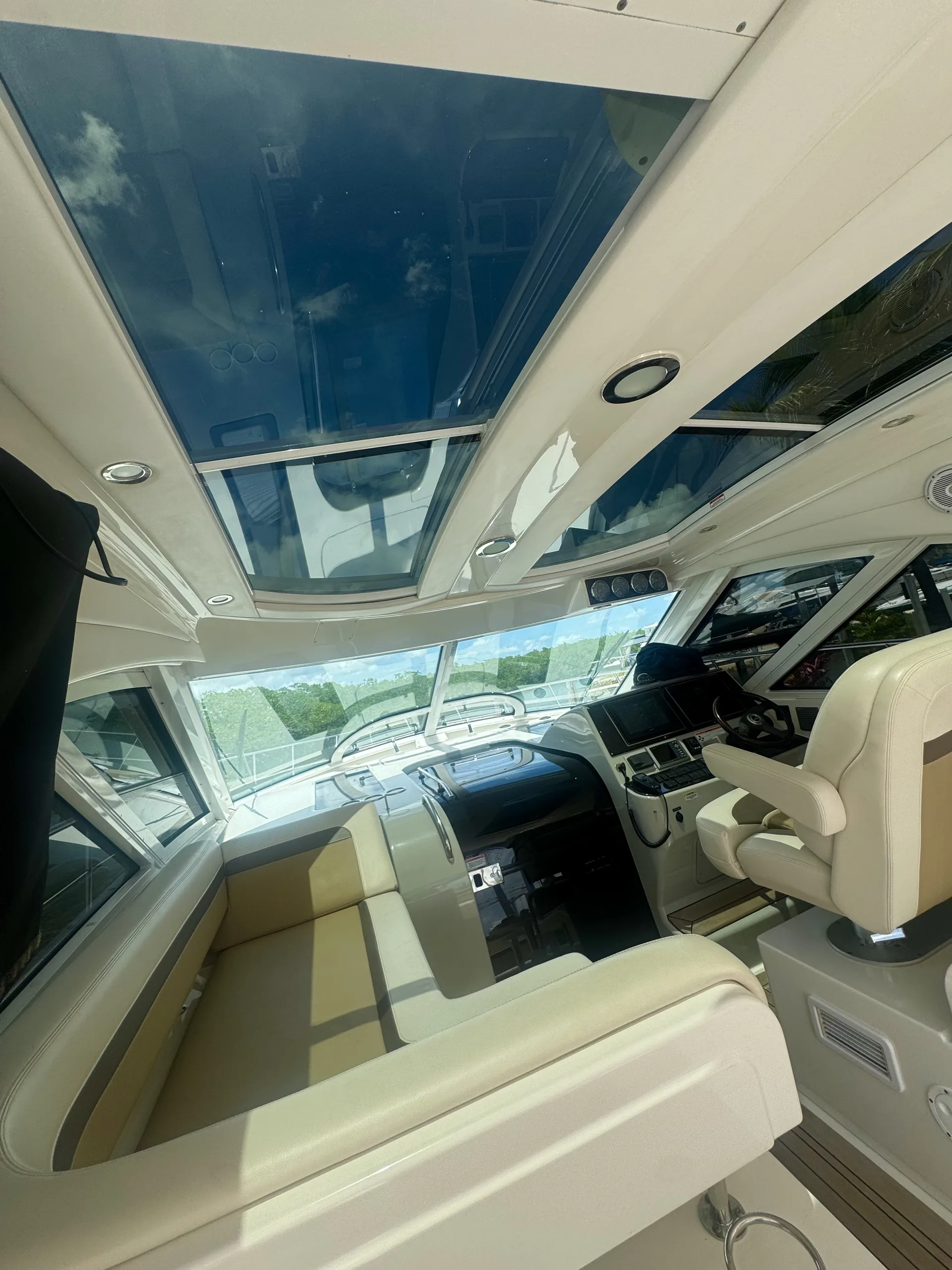 The captain's helm with wheel and instruments under the hardtop