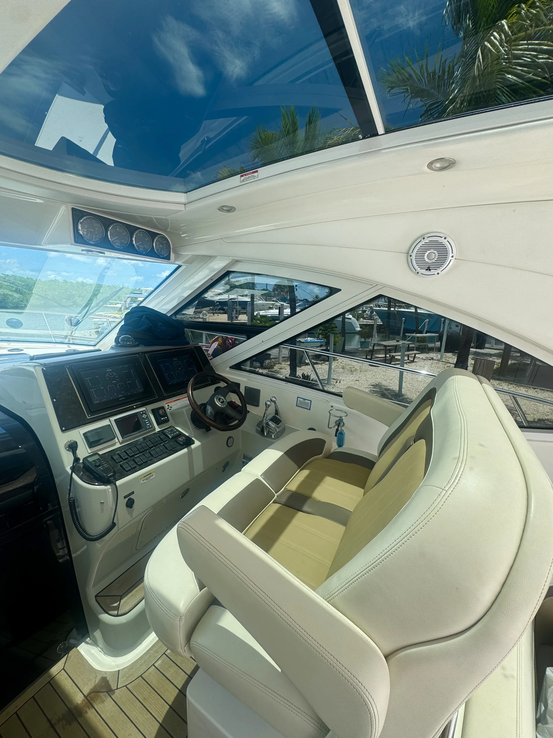 Helm and companion seating beneath the open sunroof